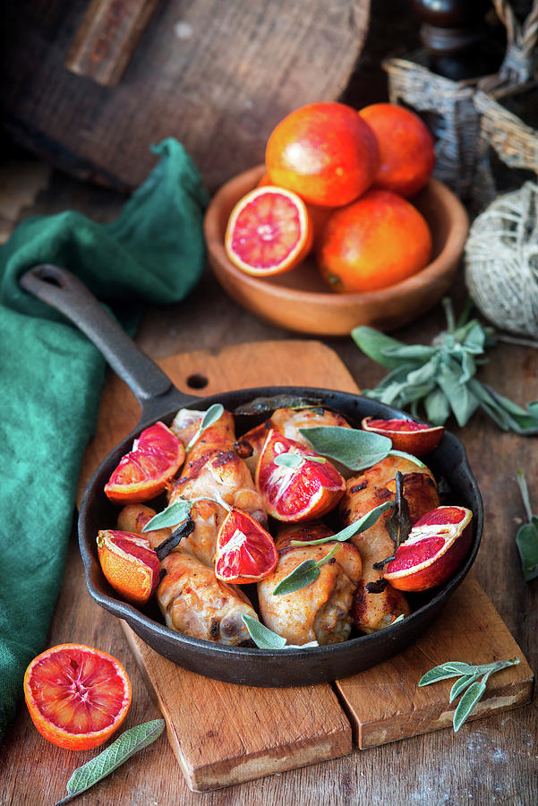 Chicken Legs With Sage And Blood Oranges Photograph by Irina Meliukh