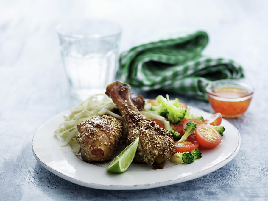 Chicken Legs With Sesame Seeds And A Side Of Vegetables For Lunch Photograph by Mikkel Adsbl