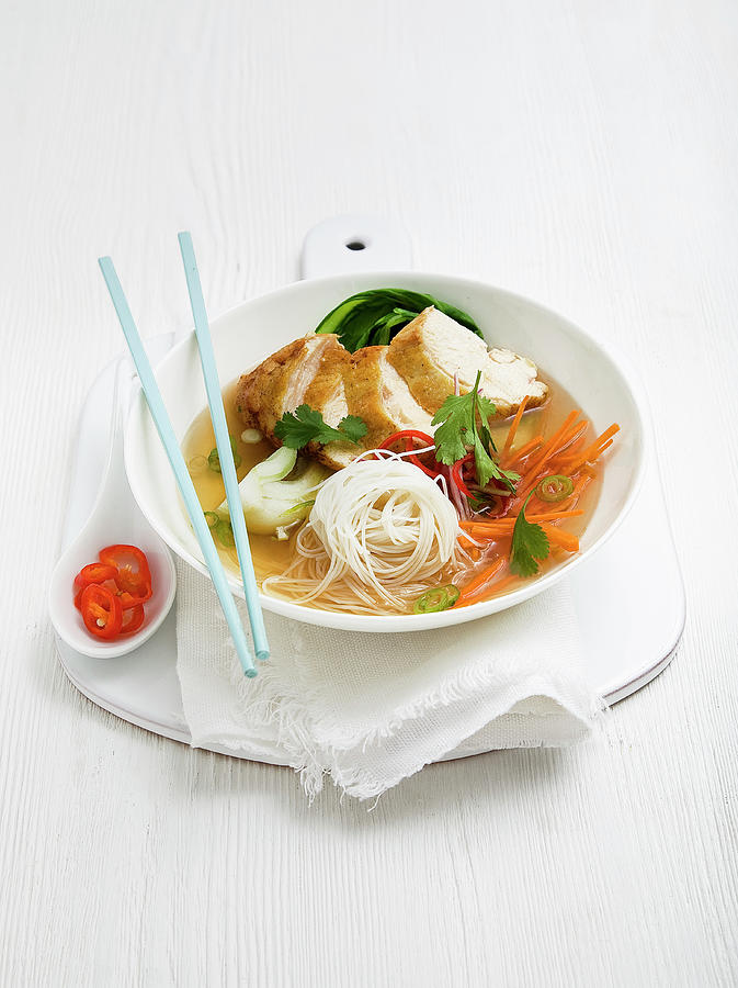 Chicken Noodle Soup With White Thin Noodles, Pak Choi, Carrot, Green Chilli And Coriander Photograph by Clive Sherlock