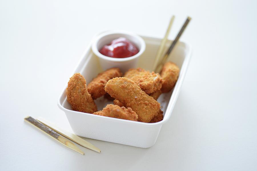 Chicken Nuggets And Ketchup In A Takeaway Carton Photograph by Tanja Major