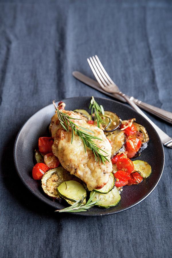 Chicken On A Bed Of Ratatouille With Rosemary Photograph by Claudia Timmann