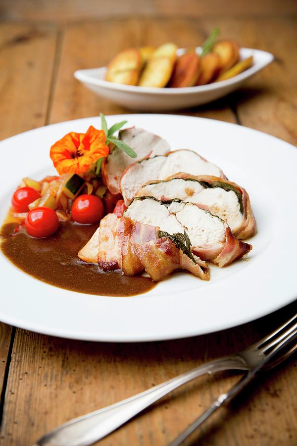 Chicken Saltimbocca With Cherry Tomatoes And Roast Potatoes Photograph by Claudia Timmann