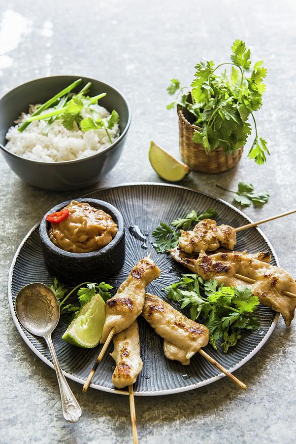 Chicken Satay Skewers With A Peanut Dip, Coriander And Rice thailand Photograph by Magdalena Hendey