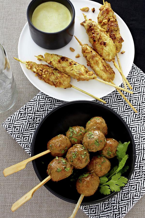 Chicken Satay With Peanut Sauce And Chicken Meatballs Kebabs With Coriander asia Photograph by Alessandra Pizzi