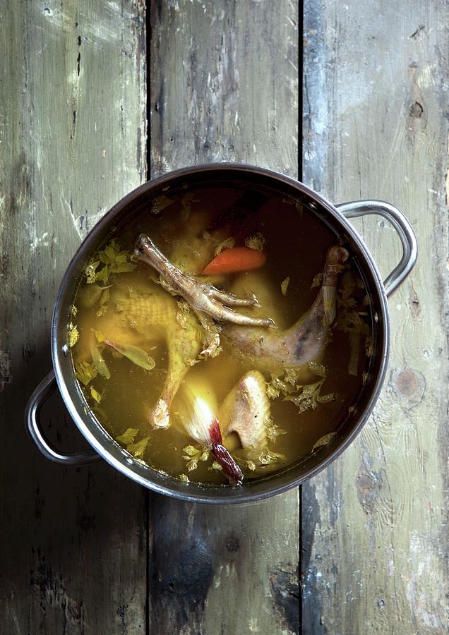 Chicken Soup With Carrots In A Saucepan Photograph by Veslemy Vrskar