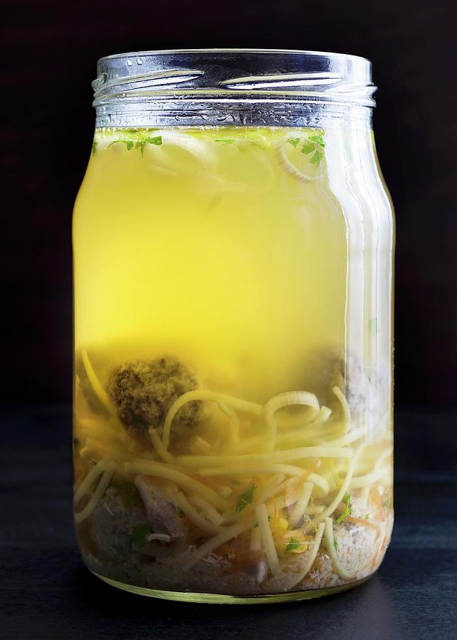 Chicken Soup With Liver Dumplings And Egg Noodles In A Glass Jar Photograph by Etienne Voss