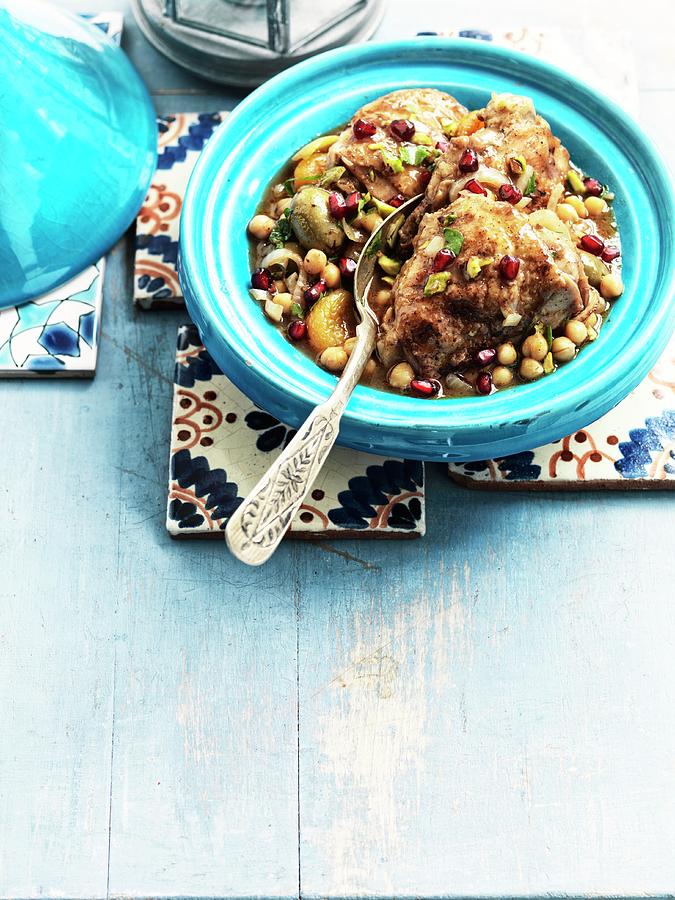 Chicken Tagine With A Fruity Sauce, Chickpeas And Pomegranate Seeds Photograph by Jonathan Gregson