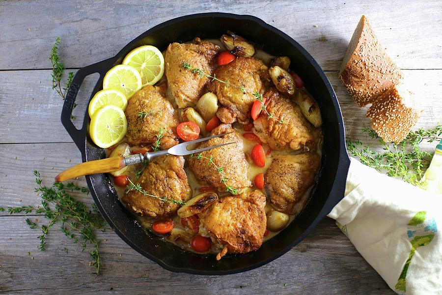 Chicken Thighs With Lemons, Garlic And Tomatoes seen From Above Photograph by Emily Clifton