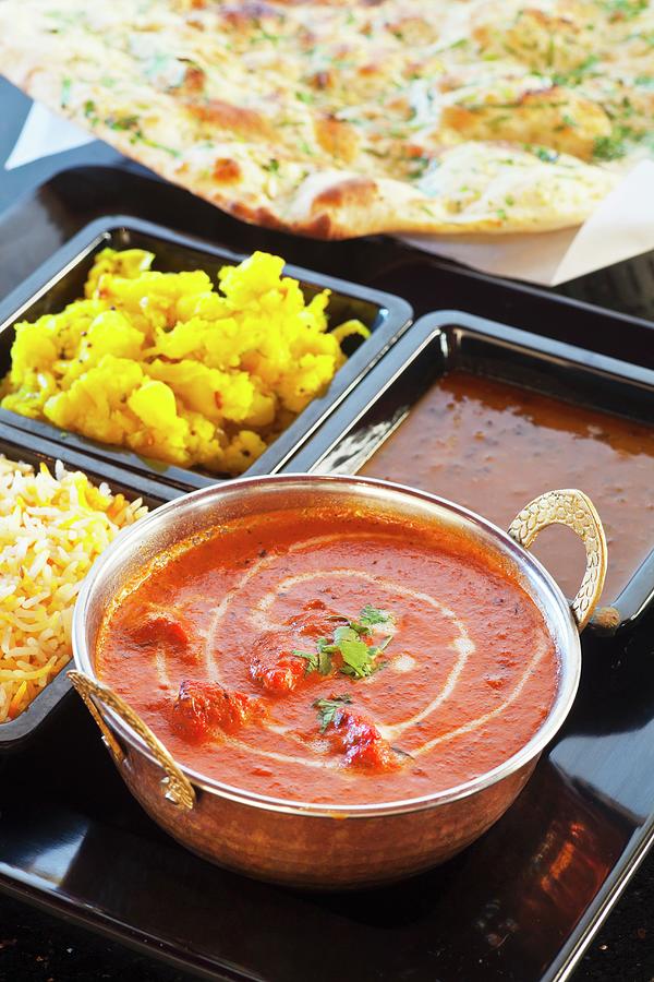 Chicken Tikka Masala With Curried Potatoes, Rice, And Lentils With Naan Bread india Photograph by Chuck Place