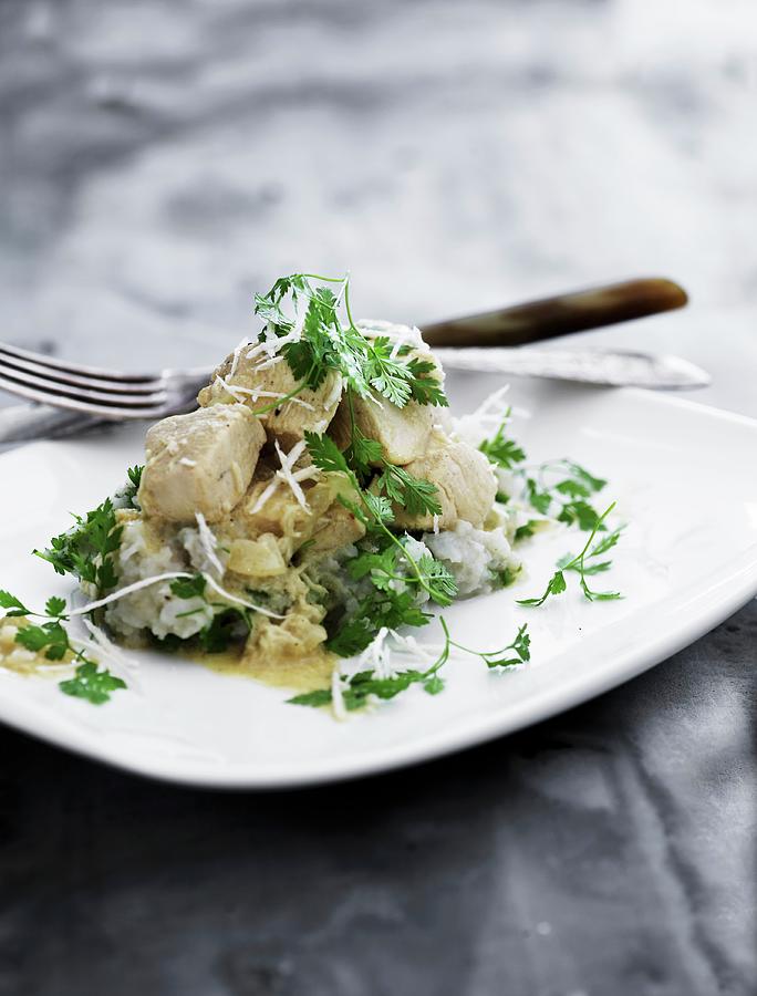 Chicken With Horseradish And Chervil On A Bed Of Rice Photograph by Mikkel Adsbl