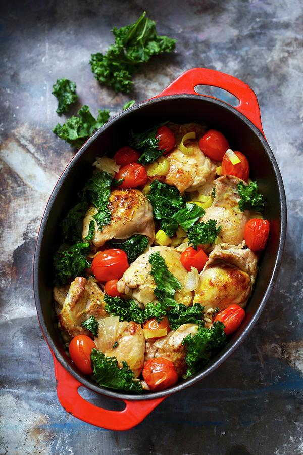 Chicken With Tomato And Kale In A Casserole Dish Photograph by Boguslaw Bialy