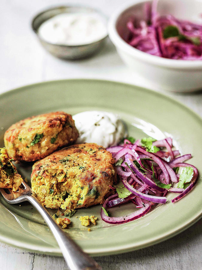 Chickpea Cakes Cut Open With Red Onion Coriander Salad And Greek Yoghurt Photograph by Michael Paul