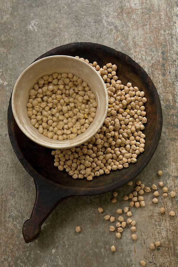 Chickpeas Dry And Soaking In Water Photograph by Joy Skipper Foodstyling