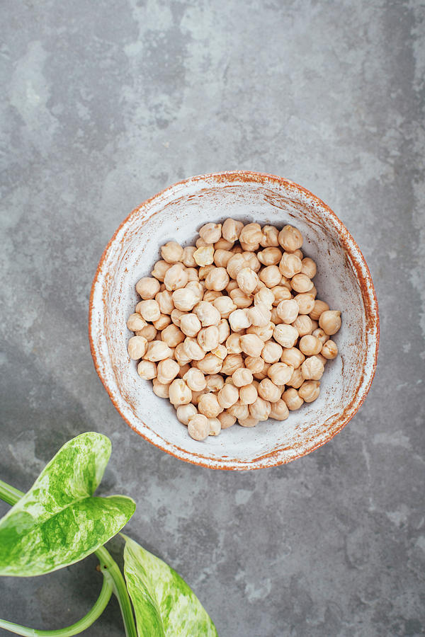 Chickpeas In A Handmade Clay Bowl Photograph by Kate Prihodko