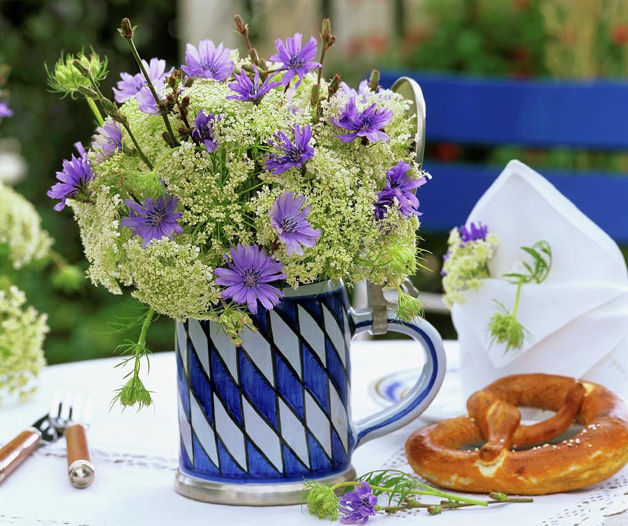 Chicory Flowers & Cow Parsley In Bavarian Beer Mug, Pretzel Photograph by Friedrich Strauss
