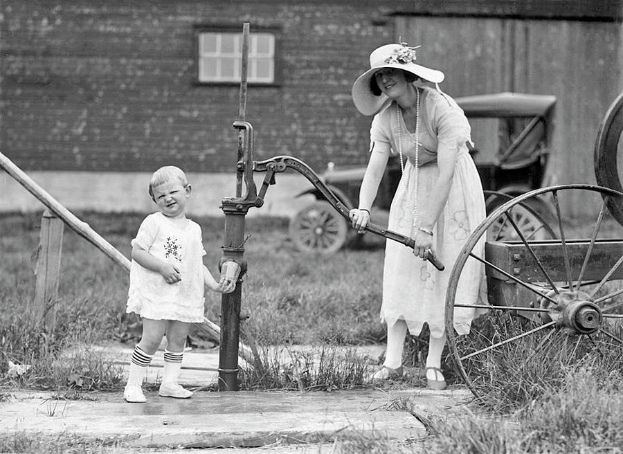 Summer Painting - Child and woman pumping water  ca  1914 by Celestial Images