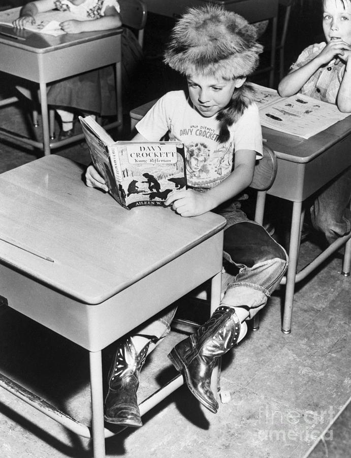 Child Reading About Davy Crockett Photograph by Bettmann