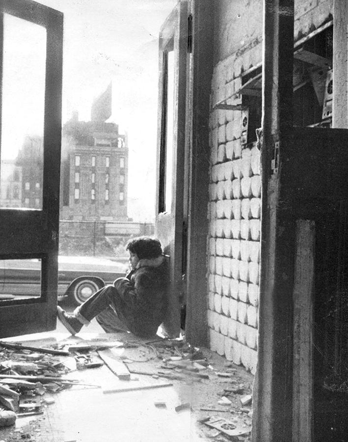 Child Sits In Doorway Of Rundown by New York Daily News Archive