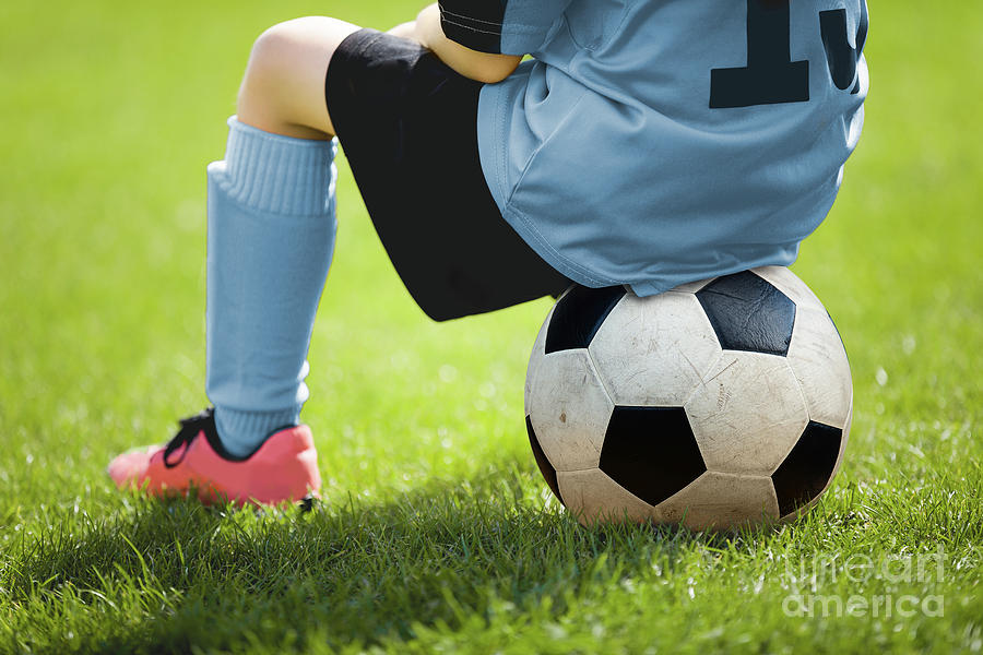 Child Sitting On Soccer Ball Young Boy With Soccer Ball Photograph By Mateusz Dembowiak