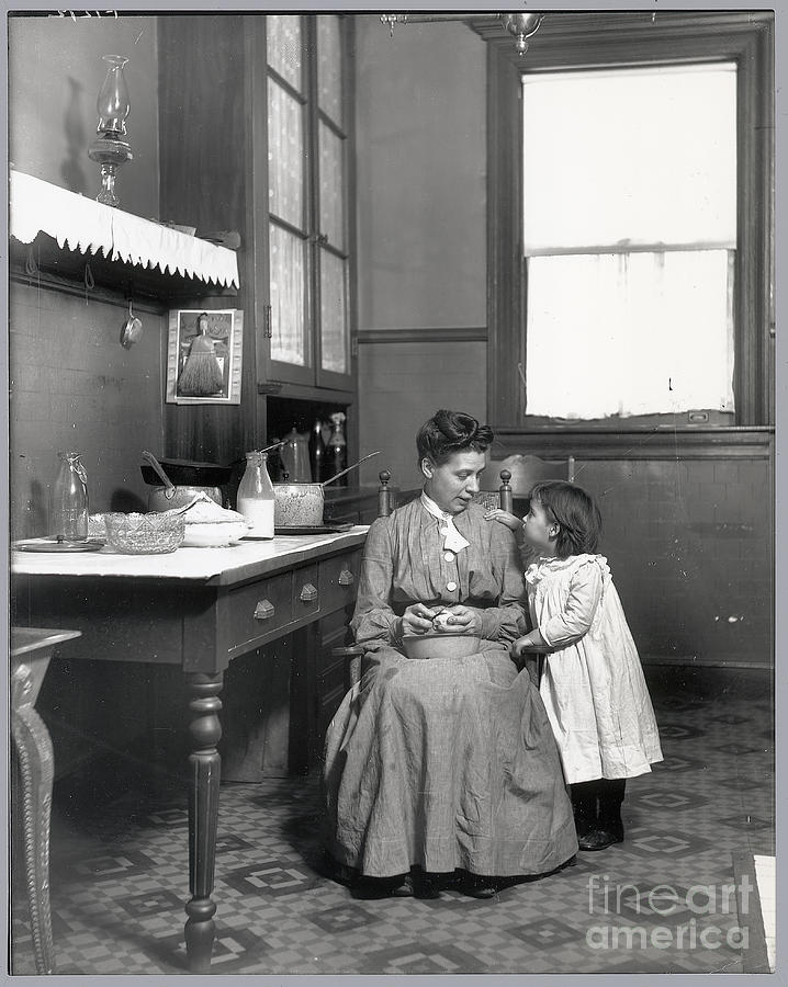 Child Watches Mother In Kitchen Photograph by Bettmann