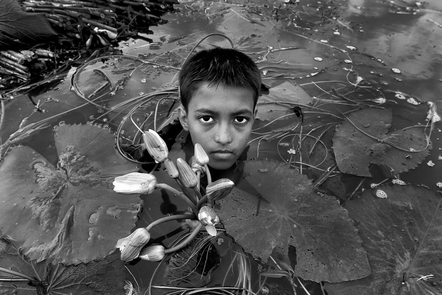 Portrait Photograph - Child With Waterlily by Abhraneel Chakraborty