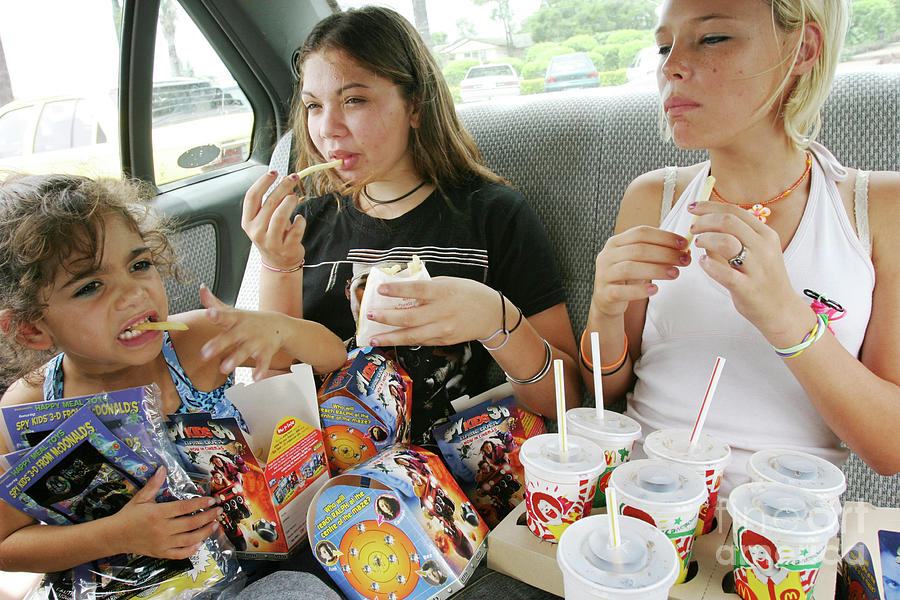 Children Eating Fast Food Photograph by Peter Menzel/science Photo Library