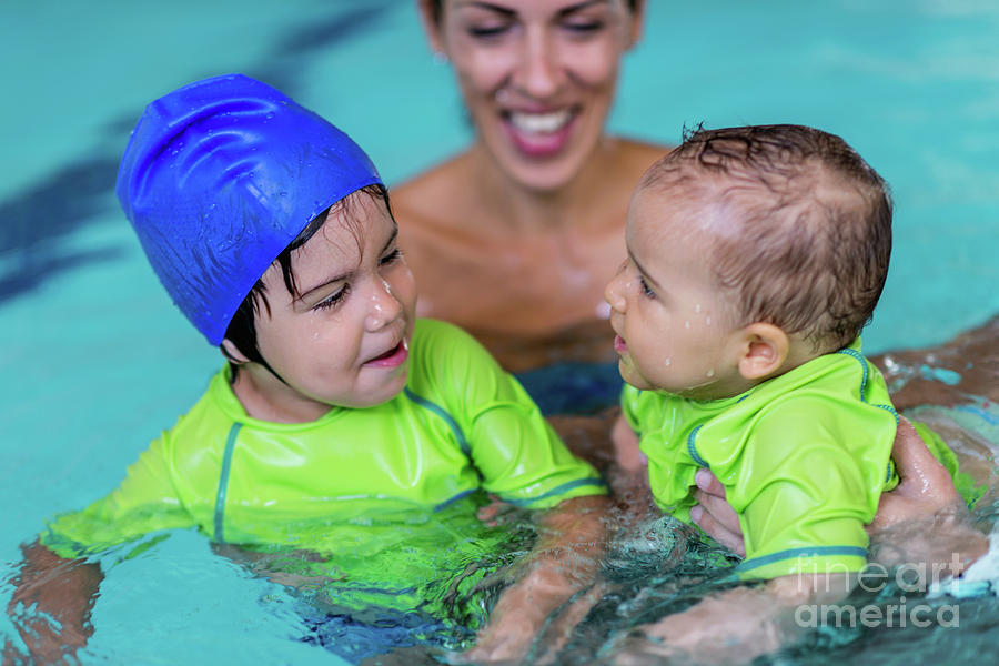 Children In Swimming Pool With Mother Photograph by Microgen Images/science Photo Library