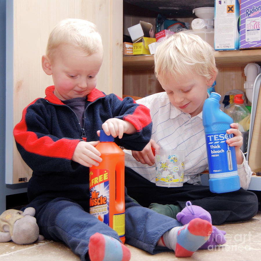 Bottle Photograph - Children Playing With Cleaning Products by Public Health England/science Photo Library