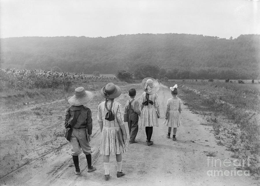 Children Strolling Down A Road Photograph by Bettmann