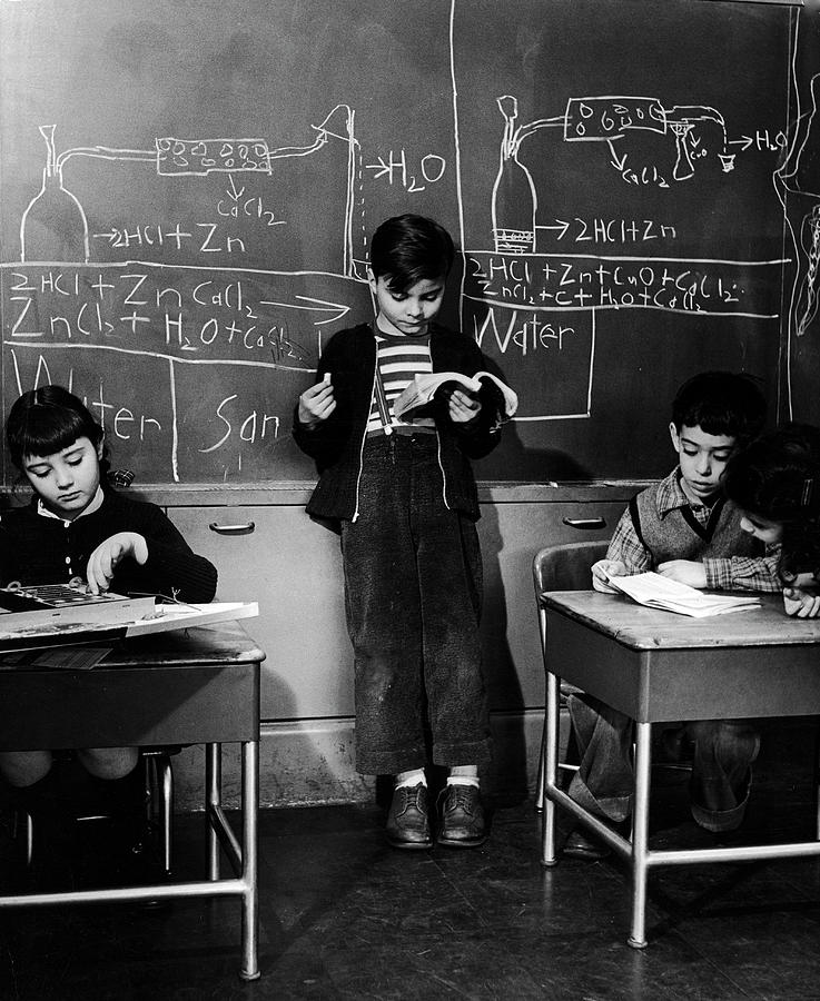 Black And White Photograph - Children Studying Nuclear Physics by Nina Leen