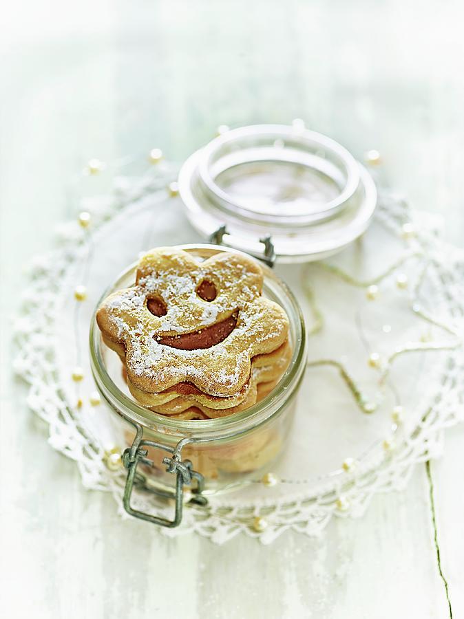 Childrens Smiley Biscuits In A Jar Photograph by Perrin