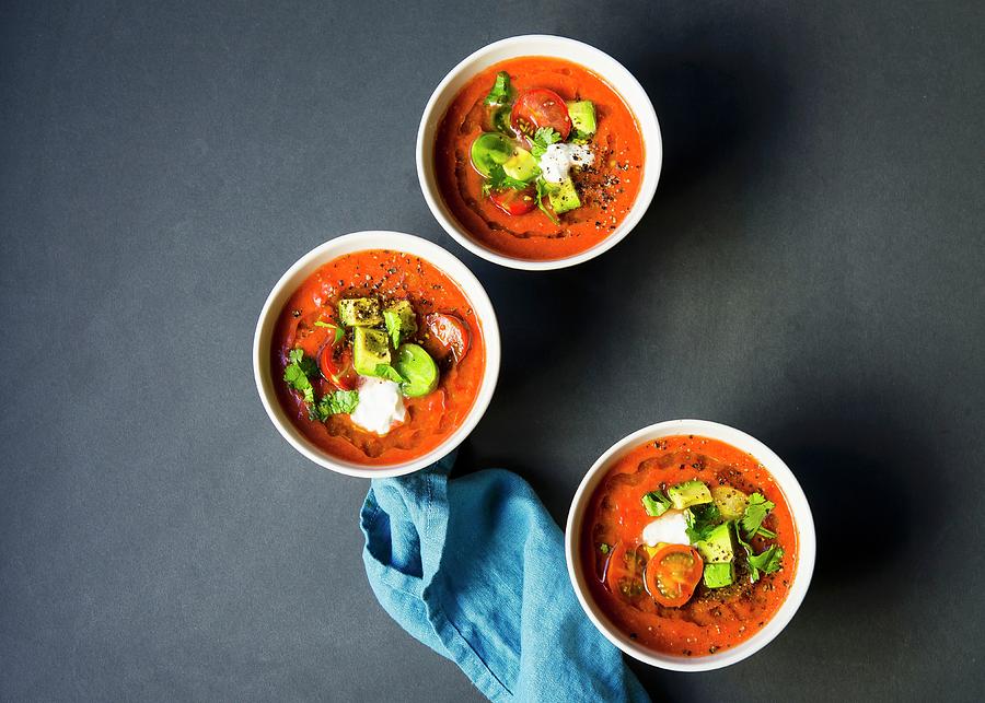Chilled Heirloom Tomato Gazpacho Soup Topped With Avocado, Cherry Tomatoes, Cilantro And A Dallop Of Sour Cream Photograph by Lisa Rees