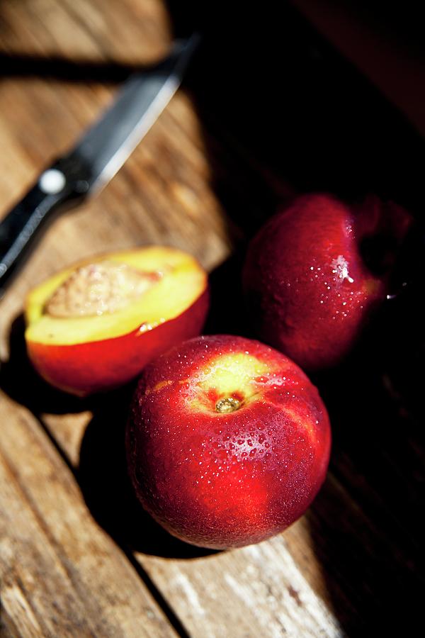 Chilled Organic Nectarines In The Late Afternoon Sunshine Photograph by George Blomfield