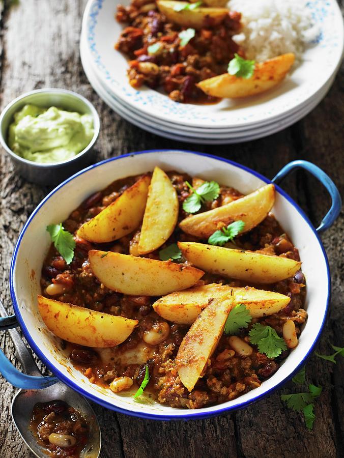 Chilli Con Carne With Potato Wedges Photograph by Clive Streeter
