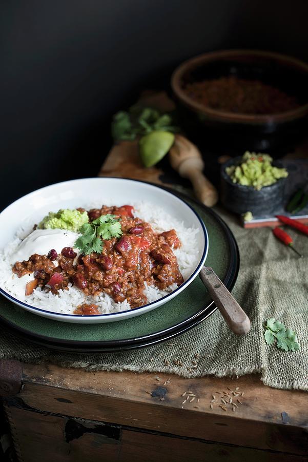 Chilli Con Carne With Rice, Guacamole And Sour Cream Photograph by Magdalena Hendey