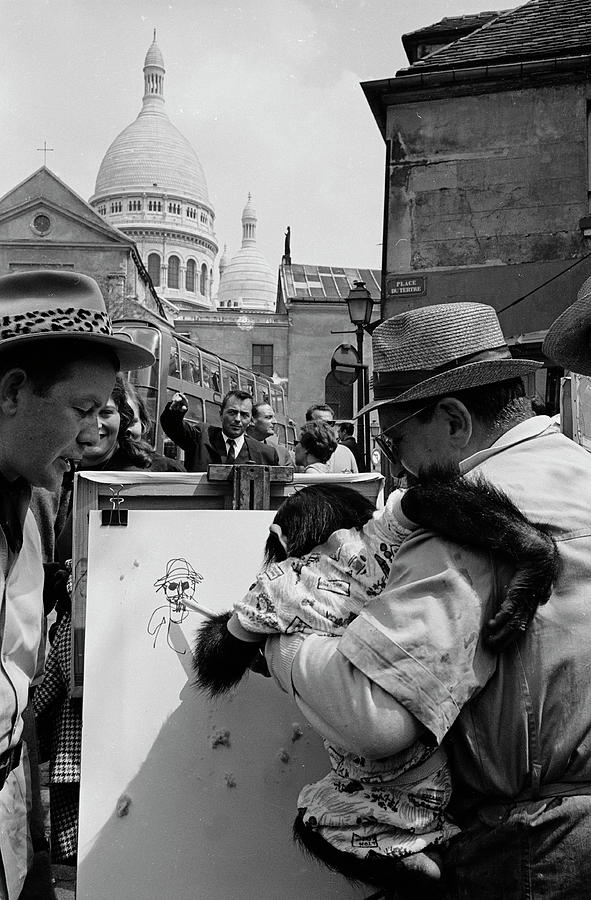 Black And White Photograph - Chimpanzee Street Artist In Place Du Tertre, Paris by Alfred Eisenstaedt
