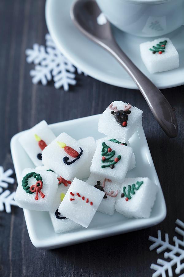 China Dish Of Sugar Cubes With Christmas Motifs In Food Colouring Photograph by Franziska Taube