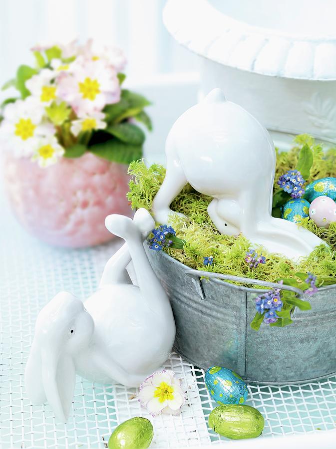 China Easter Bunnies And Chocolate Eggs In And Around Metal Container Photograph by Biglife