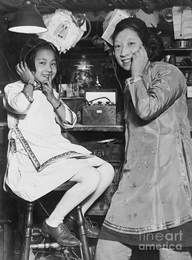Chinese Girls Enjoying Radio Photograph by Bettmann