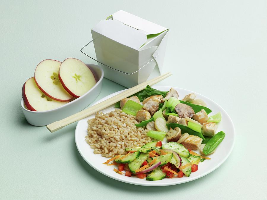 Chinese Take Out Dinner On A Plate With Take Out Carton, Apples And Chopsticks Photograph by Comet, Rene