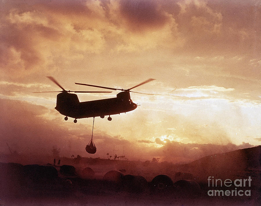 Chinook Helicopter Lifts Ammunition Photograph by Bettmann