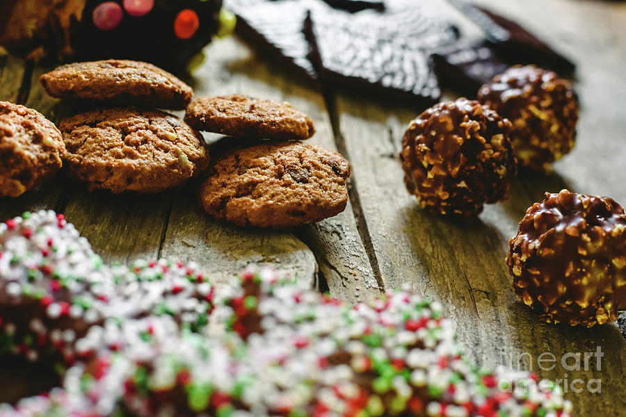 Chip cookies and chocolates pralines to take pleasure in Christmas holidays Photograph by Joaquin Corbalan