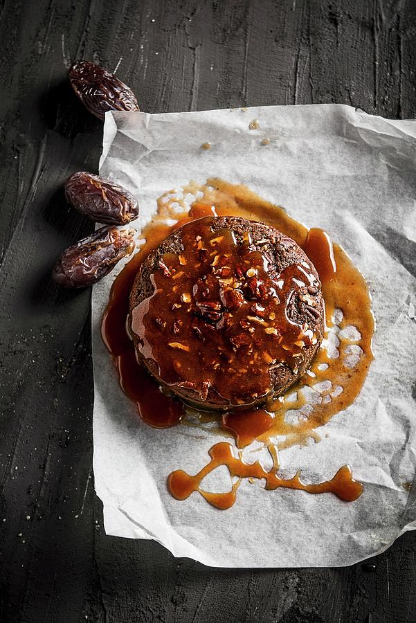 Chocolat Cake With Caramel Sauce, Pecan Nuts And Dates Photograph by Ben Yuster