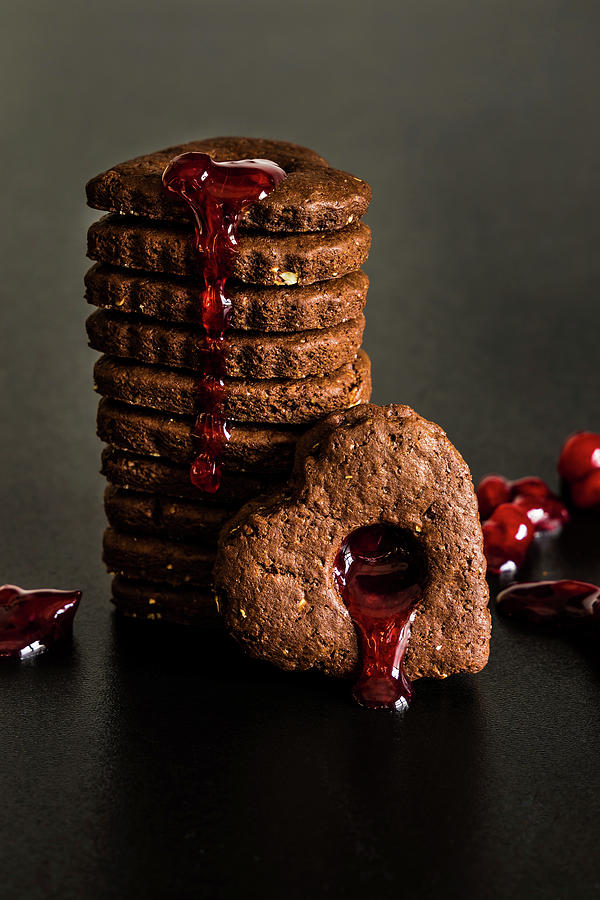 Chocolate And Almond Heart Shaped Cookies With Cranberry Syrup Photograph by Alla Machutt