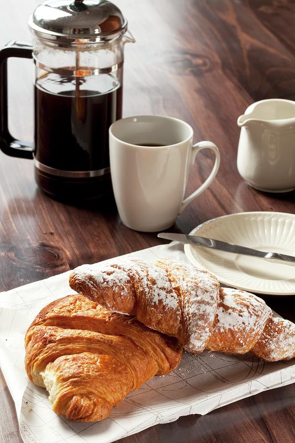 Chocolate And Cinnamon Croissants And A Cup Of Black Coffee Photograph by Creative Photo Services