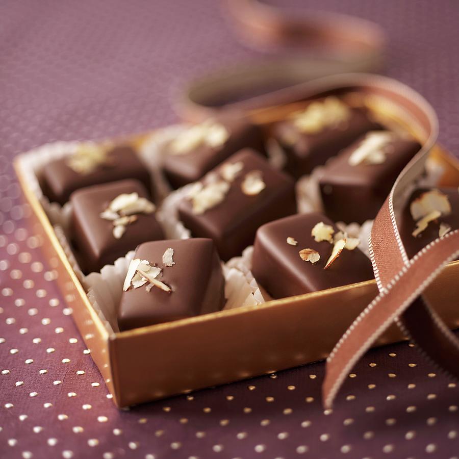 Chocolate And Nut Pralines In A Gift Box Photograph by Oliver Brachat