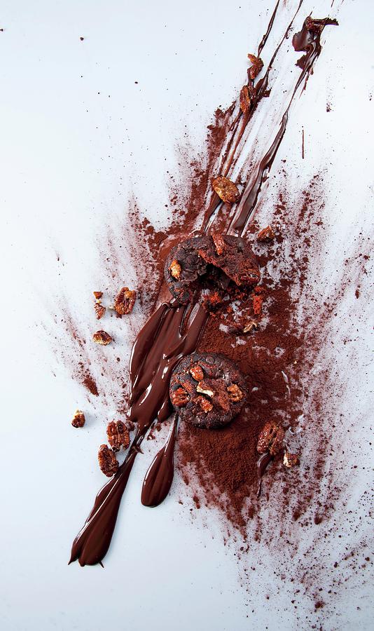 Chocolate And Pecan Nut Cookies With Chocolate Sauce And Cocoa Powder Photograph by Christophe Madamour