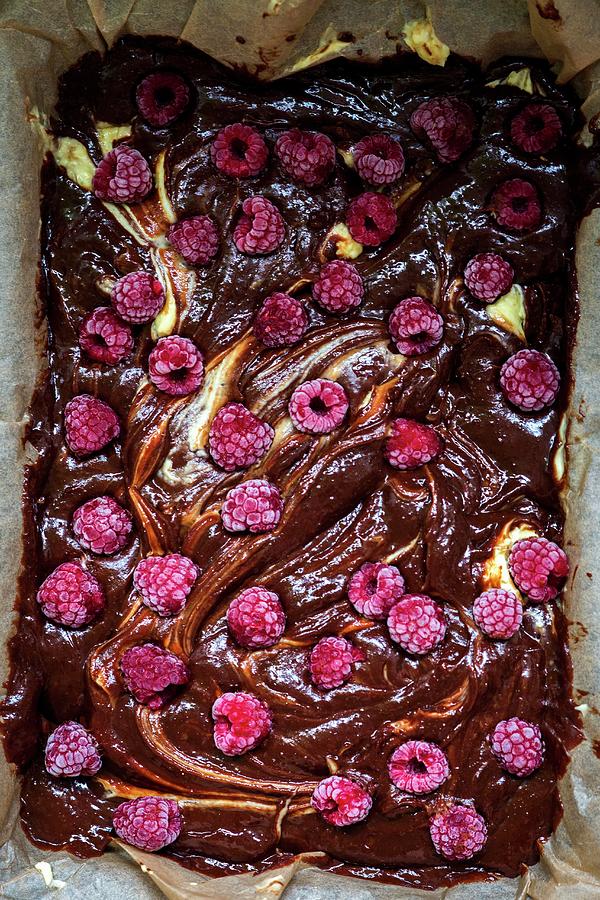 Chocolate And Raspberry Brownie Cheesecake Before Baking close-up Photograph by Irina Meliukh