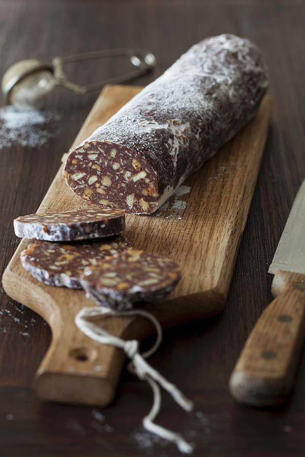 Chocolate Biscuit Salami With Walnuts And Rum no Bake On Cutting Board Photograph by Yelena Strokin