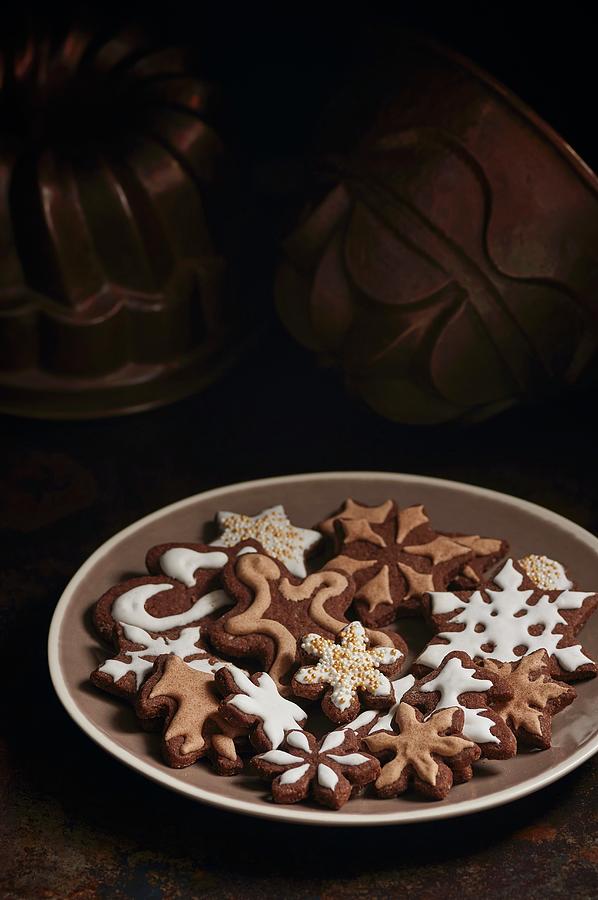 Chocolate Biscuits, Decorated With Icing Photograph by Ulrike Emmert